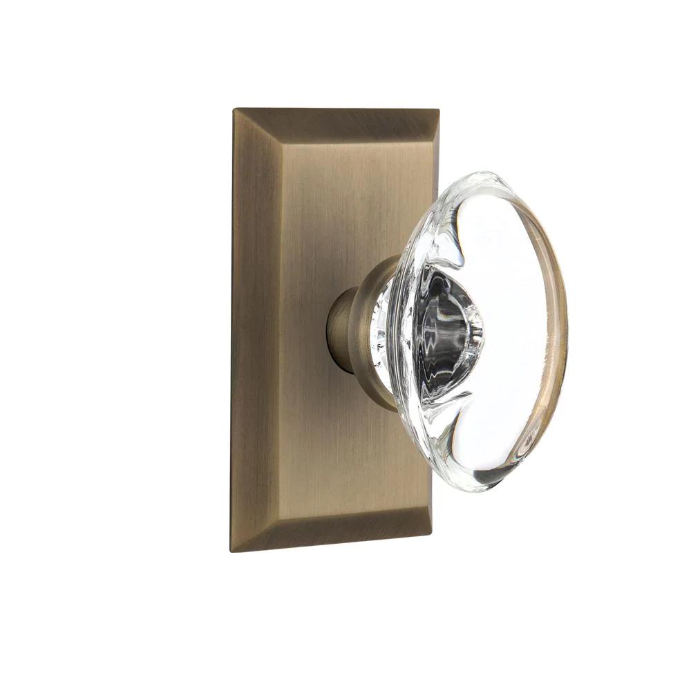 Studio Plate 2-3/4 in. Backset Antique Brass PassaHall/Closet Oval Clear Crystal Glass Door Knob