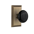 Studio Plate 2-3/8 in. Backset Antique Brass PassaHall/Closet Black Porcelain Door Knob